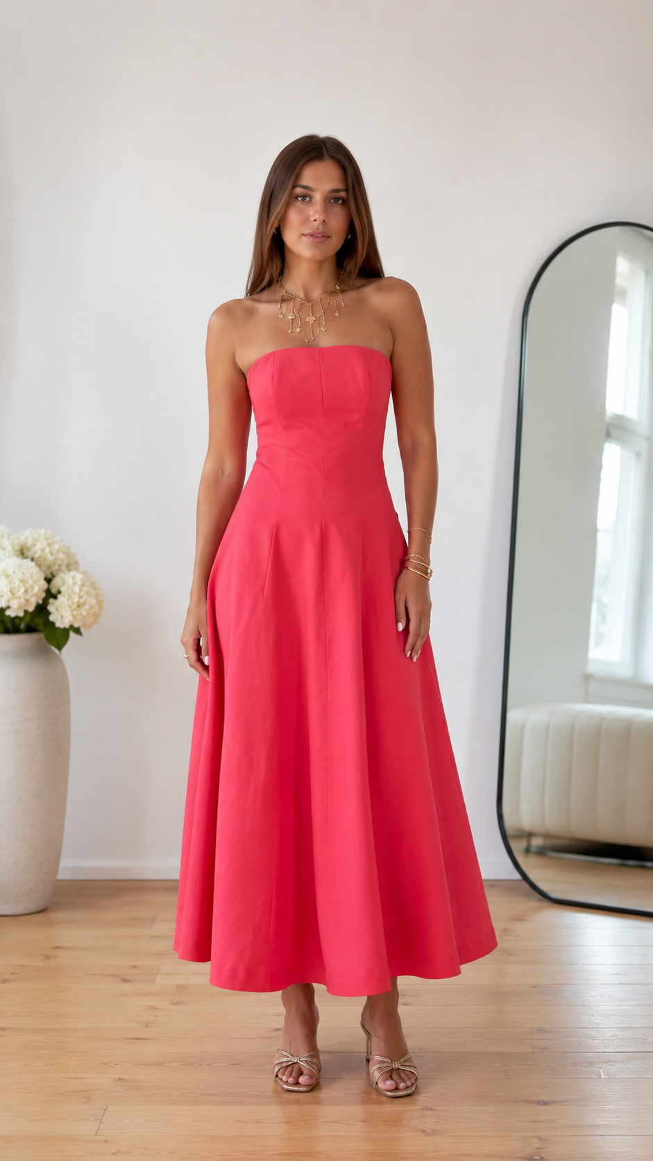 Front view of coral pink strapless A-line midi dress