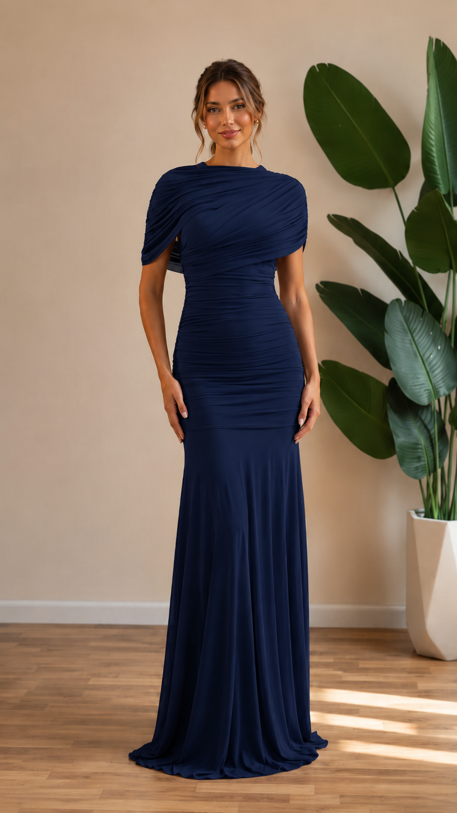 Front view of navy ruched mermaid maxi gown